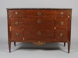 an antique chest of drawers with marble top and brass handles