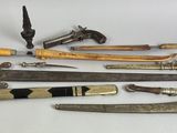 a lot of different types of knives on the table