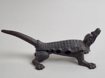 an image of a dog figurine made out of iron