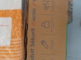 a box of toilet paper sitting on the floor next to a box of toilet paper