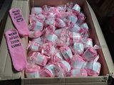 a box full of pink and white candy wrapped in plastic wrap