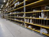 a lot of shelves that have rolls of toilet paper on them