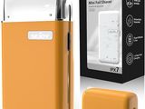 an image of an orange electric shaver next to a box
