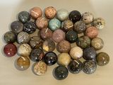 a pile of different colored stones on a table