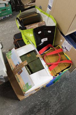 a box full of luggage sitting on the floor