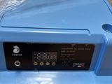 a blue plastic box with a digital clock on it