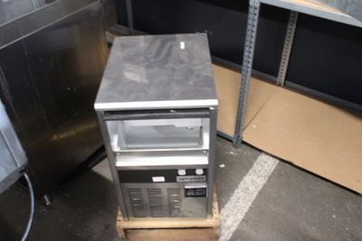 an image of a microwave sitting on a pallet in a warehouse