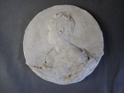 a picture of a plaster bust of a woman