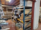 a room filled with lots of boxes and boxes on the shelves