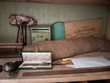 a wooden table with a box and a pair of scissors on it