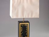 an image of a black and gold table lamp with a white shade