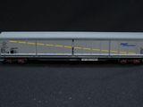 a close up of a toy train car on a black surface
