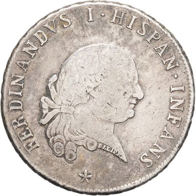 a close up of a silver coin with a man ' s head on it