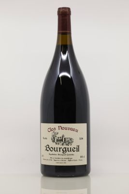 the bottle of red wine is sitting on the table