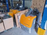 many boxes of equipment sitting in a warehouse area