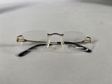 a pair of glasses sitting on a table next to each other