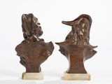 pair of bronze busts of a man and a woman on marble bases
