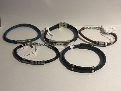 four different bracelets are shown on a white surface