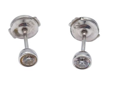 pair of diamond stud earrings on a white background