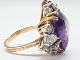 an amethorate and diamond ring set in 18k yellow gold
