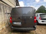 a van that is parked next to a building