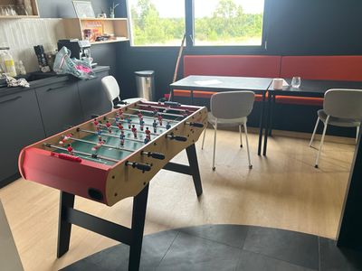 a foosball table in the middle of the room