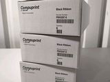 three black and white boxes stacked on top of each other on a table