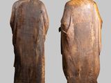 two statues of a man and a woman standing next to each other