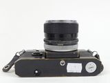 a black camera with a black lens on a white background