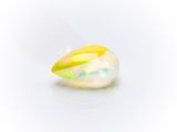a close up of a white oplite stone with a yellow center