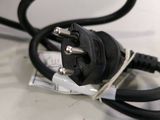 a close up of a black power cord connected to a computer mouse