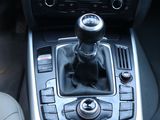 a close up of a car ' s gear lever in the center of the car