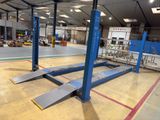 a picture of a large warehouse with a lot of equipment on the floor