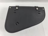a close up of a black leather saddle bag on a white surface