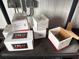 many boxes of tech max on a table in a room