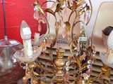 a chandelier that has a bunch of glass flowers on it