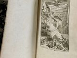 an old book with a picture of a man riding a horse