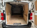 a white van with a wooden floor in the back of it