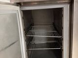 an open door to a stainless steel oven in a kitchen