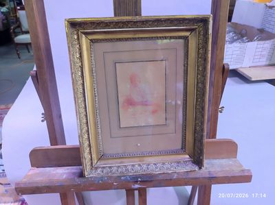 a picture of a picture of a woman in a picture frame on a easel