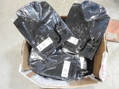 a cardboard box filled with a bunch of black electronic devices