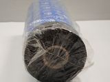 a roll of black yarn wrapped in plastic on a table