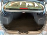 the back of a car with its trunk open and the back seat down