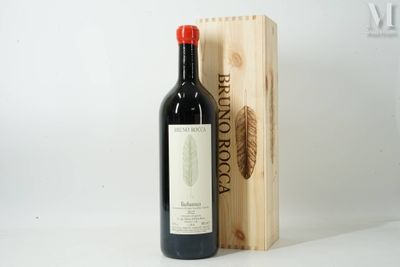a bottle of wine sitting next to a wooden box