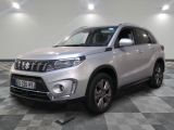 the silver suv is parked on a checkered floor in a room