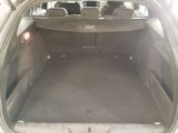 the back of a car with its trunk open and the back seats down