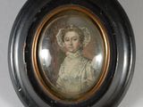 tableau représentant une femme coiffée d'un bonnet, dans un cadre ovale noir