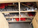 many tools on the shelves in the garage