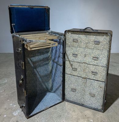 two pieces of luggage sitting next to each other on the floor
