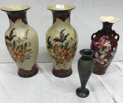three vases are sitting on a table with a white background